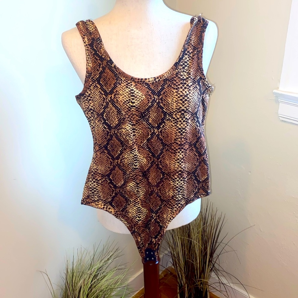Used like new top with crotch snaps.